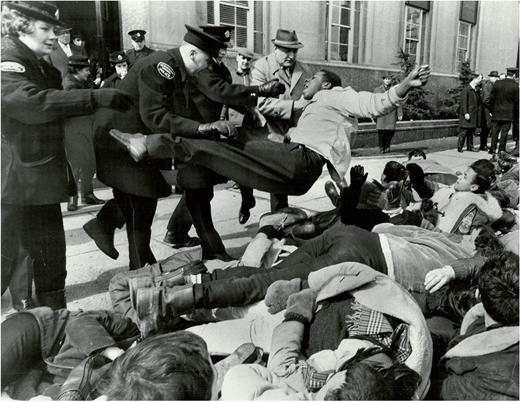 Police toss demonstrators to the curb during a student demonstration in front of the U.S. Consulate on University Avenue in Toronto, March 16, 1965. Photograph by Gerry Barker. Toronto Star Photograph Archive, courtesy of Toronto Public Library.