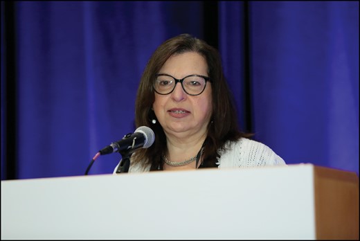 Lisa Stump welcomes participants to the AI Summit. Photo courtesy of ASHP.