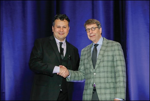 ASHP Chief Executive Officer Paul Abramowitz welcomes keynote presenter Harvey Castro. Photo courtesy of ASHP.