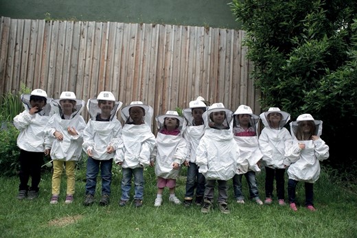 Children taking part in a beekeeping session at Zone sensible, ‘Les Petites Abeilles’. Photograph by Olivier Darné. Saint-Denis, 2024. © Olivier Darné.