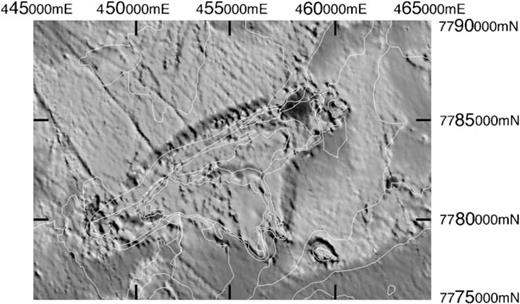 Image of the reduced-to-the-pole total magnetic intensity over the Tuckers Range area. The direction of magnetization used in the reduction algorithm was the Early Permian palaeofield direction recorded by the TIC. Mapped geological boundaries from Fig. 4 are shown in white. The dark bands that surround the main body of the TIC and the TIC outlier are reduced-to-the-pole highs (total magnetic intensity lows in the original data) that represent zones of reversed NRM owing to thermal overprinting of host rocks by the TIC in the Early Permian. After Schmidt & Clark (1998). This figure is in colour in the online version of the journal on Blackwell Synergy, where the dark bands are represented by magenta.