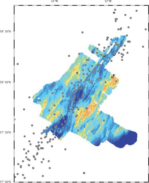 Recent earthquake locations within the RAMESSES study area. Grey dots show event locations obtained from the USGS catalogue (1976–2002), while ‘beach balls’ show fault mechanisms (double couple only) for larger events from the Harvard CMT catalogue. The majority of events lie within the median valley. The range of dips of normal nodal planes is ∼35–55°. The seabed bathymetry is shown for reference.