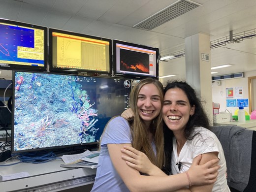 Kelsey sharing in the excitement of deep-sea science during an ROV dive with her friend and fellow ECS, Beatriz Vinha, aboard the iMirabilis2 cruise on R/V Sarmiento de Gamboa in August 2021.