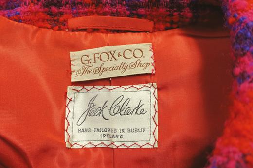 1958 plaid wool Jack Clarke suit label. The term ‘hand tailored’ is used on the label of the 1958 Jack Clarke suit to denote that the manufactured garment’s lining is hand-finished. Photo courtesy of UConn’s Costume and Textile Collection.
