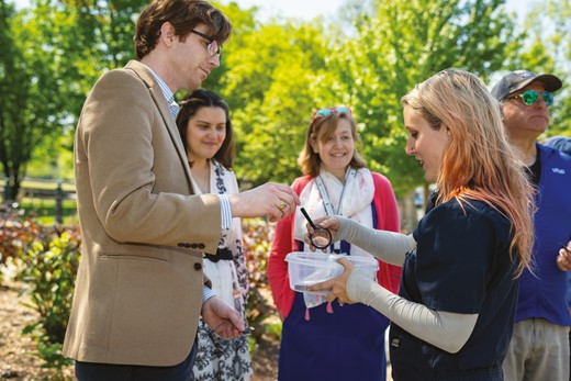 Rebecca Blithe, Advanced Gardener within the CGA Capitol Gardening Division, engages the public to learn more about beneficial lacewing larvae (Chrysoperla spp.) as natural predators of common landscape insect pests such as aphids and scales. In this photo, she is teaching interested participants how to properly identify these beneficial insects using a hand lens during a special commemorative Earth Day event in April 2023.