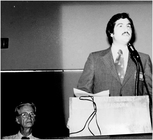 1979 Annual Convention of the Association for Behavioral Analysis: Dennis Russo, PhD, presenting with B.F. Skinner, PhD, in background.