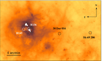 Spitzer 24 μm image of the 30 Doradus star-forming complex with position of its central cluster, R136, marked by the diamond point. The positions of the very massive binary R145 and two runaway stars, 30 Dor 016 and Sk −69°206, are marked by circles. See text for details.