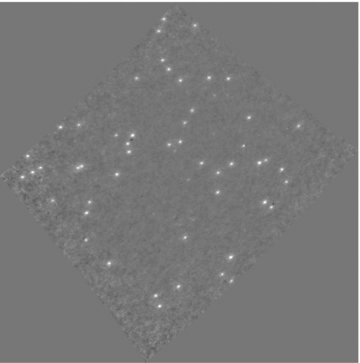 Residual image, with the 50 brightest sources subtracted, after five iterations. The black and white scale runs between −1 and 2 Jy beam−1. The presence of negative peaks is due to a subtraction in the absence of a full sky model.