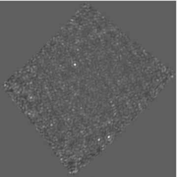 Residual image, with the brightest source subtracted, after three iterations. The black and white scale runs between −10 and 15 Jy beam−1. Three new sources are visible.