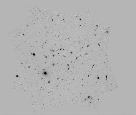 HST/ACS F625W image of MACSJ0717, with a pixel scale of 0.065 arcsec pixel−1 and dimensions 325 arcsec × 325 arcsec; black circles show the final sample of 17 galaxies.