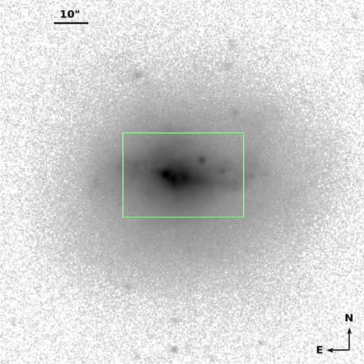 SDSS r-band image, showing the bright central region and an elliptical halo of older stellar population in NGC 4670. The green rectangular box shows region covered by the HST image shown in Fig. 2.