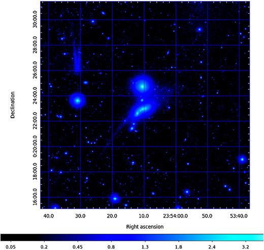 HCG 98 from the deep r image of the IAC Stripe 82 Project (Fliri & Trujillo 2016). The image has been contrast-stretched and is presented here with a logarithmic look-up table to emphasize faint features. Equatorial J2000 coordinates set the scale of this image, which has north to the top and west to the right.