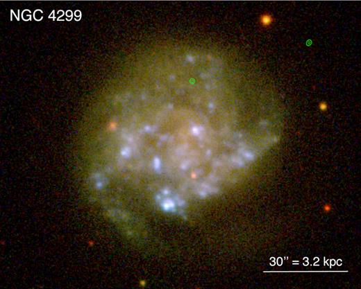 SDSS image of NGC 4299, with Chandra/ACIS-S contours overlaid in green (seen to the right of the galaxy). North is up; east is to the left.