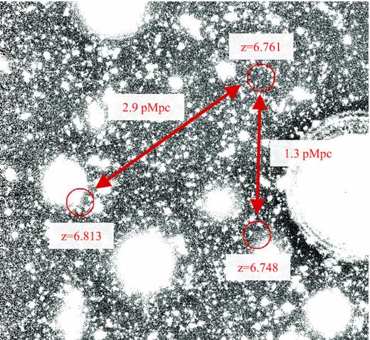 Illustration of three closely separated Ly α emitters in our z ≃ 7 sample. All three sources fall within a spherical region with radius R = 1.7 physical Mpc, consistent with the expected sizes of H ii regions at z ≃ 7 (e.g. Lin et al. 2016). The proximity of these Ly α emitters thus may plausibly reflect the presence of a large ionized bubble.