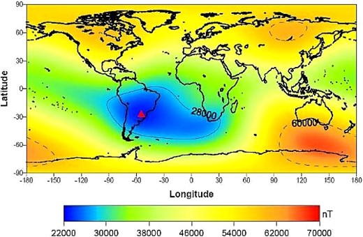 Geographycal distribution (latitude vs. longitude) of the geomagnetic field intensity over the Earth. The South Atlantic Anomaly (SAA) region is limited by the region where the geomagnetic field intensity is less than 2800000 nT. The red triangle indicates the location of the Tupi muon telescopes. (Color online)