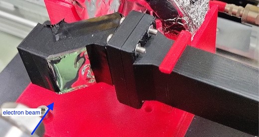 Photograph of the OTR foil. The aluminium foil is attached to a 1 cm square window.