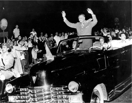 President Nasser of Egypt waves to the crowds after nationalizing the Suez Canal Company, July 1956.