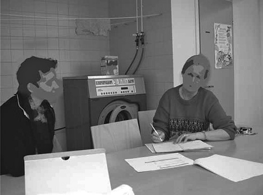  Researcher (right) discussing with a research participant (left).