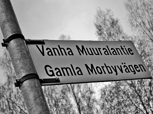  A literal photograph. One can understand both languages; street signs are in both Finnish and Swedish.
